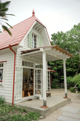 The porch of the Kusakabe house with the rotting supports of the trellis from the movie “My Neighbor Totoro”